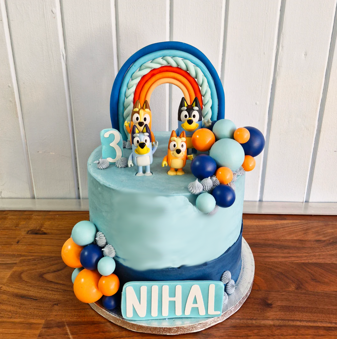 Luxury bluey themed cake with your favourite characters and personalised with a name