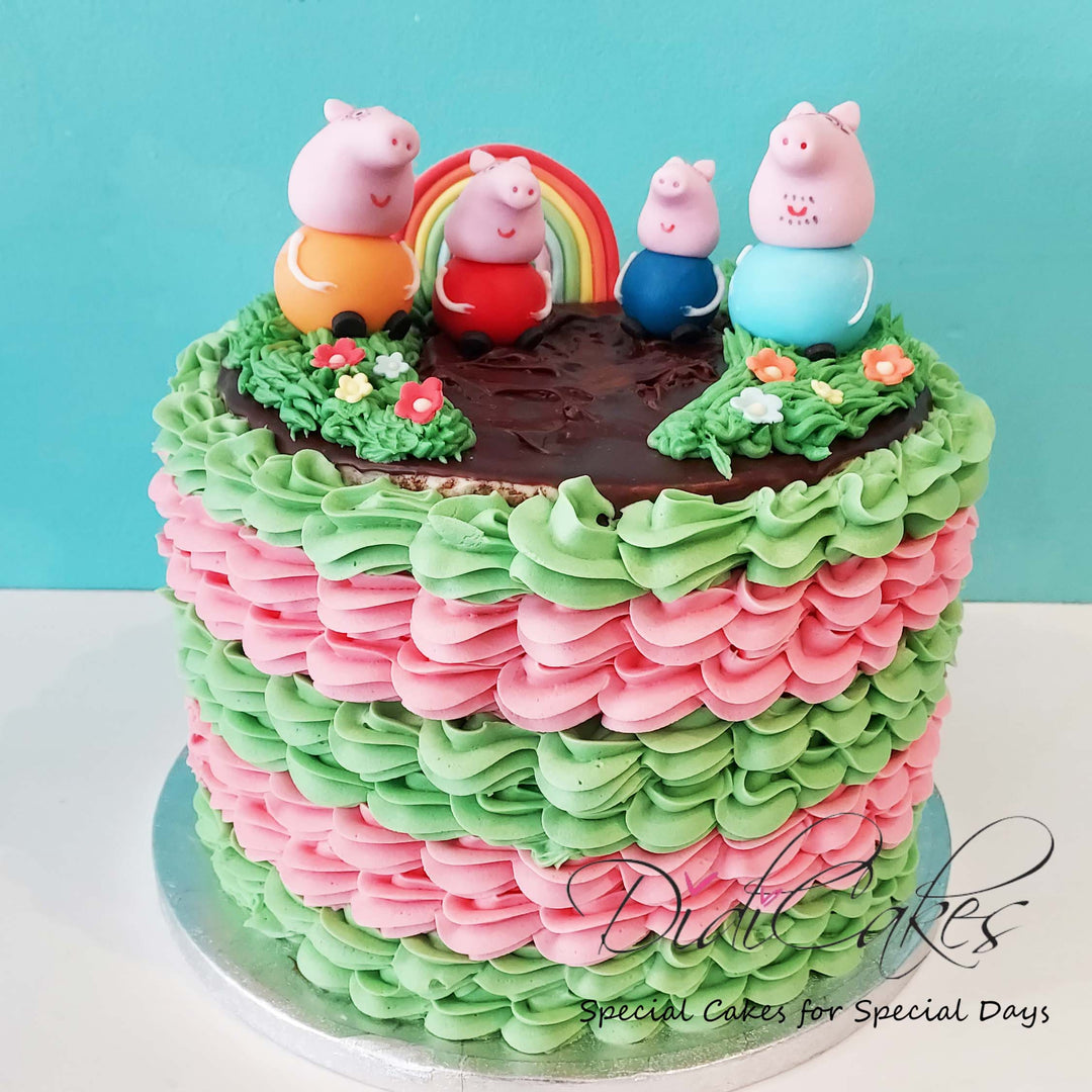 A gluten free cake decorated to look like a scene from Peppa Pig, with character figures on top and a colorful frosting.